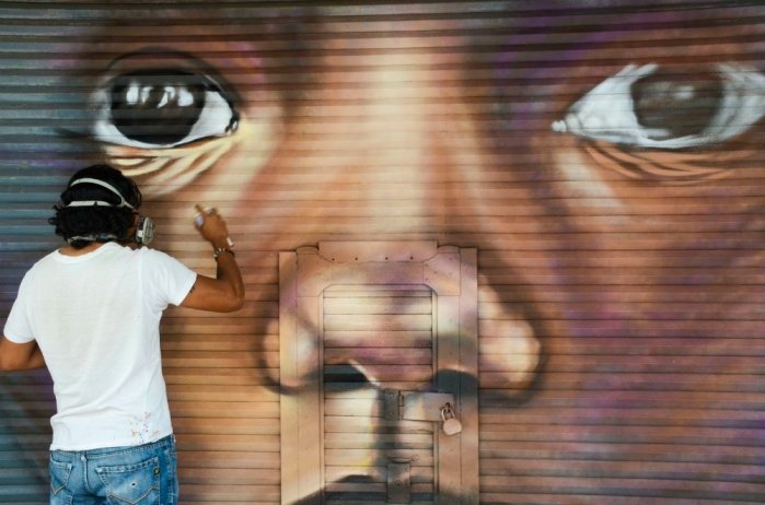 Lleva Gobierno de CDMX arte urbano a cortinas metálicas